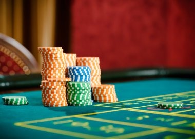 Mobile phone displaying Angka Ikut betting interface with number grid and live dealer feed